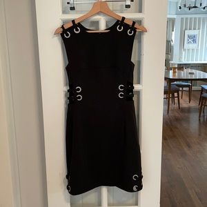 Black mini dress with silver metal grommets